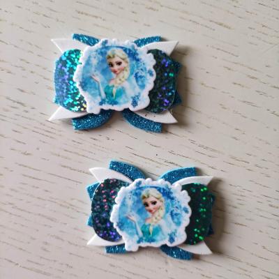 RDN002 Lot de 2 barrettes crocodile noeuds blanc et bleu turquoise anna et elsa reine des neiges